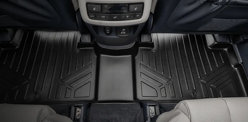 Side-by-side view of Smartliner and WeatherTech car floor mats illustrating differences in material quality and design.