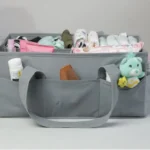 A neatly organized diaper caddy filled with baby essentials like diapers, wipes, and creams.