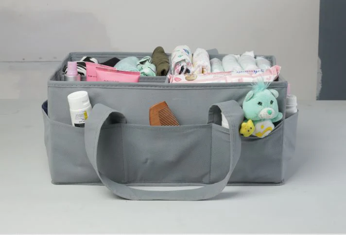 A neatly organized diaper caddy filled with baby essentials like diapers, wipes, and creams.